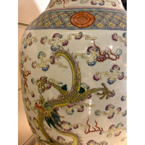 48 - A pair of Chinese famille rose porcelain lamps, with enamel dragon decoration and gilt-metal mounts,... 