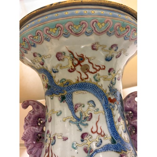 48 - A pair of Chinese famille rose porcelain lamps, with enamel dragon decoration and gilt-metal mounts,... 