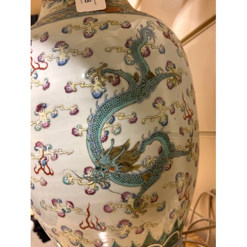 48 - A pair of Chinese famille rose porcelain lamps, with enamel dragon decoration and gilt-metal mounts,... 