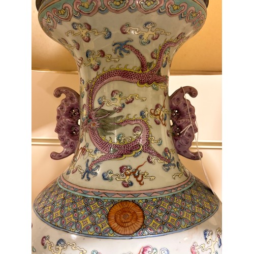 48 - A pair of Chinese famille rose porcelain lamps, with enamel dragon decoration and gilt-metal mounts,... 