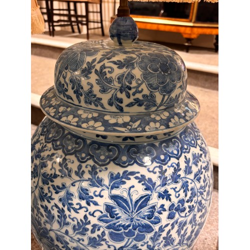 52 - A large pair of Chinese blue and white porcelain lamps on wooden bases, height to top of covers 65cm