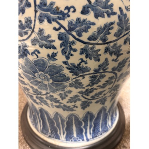 52 - A large pair of Chinese blue and white porcelain lamps on wooden bases, height to top of covers 65cm