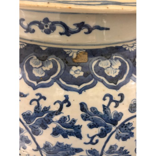 52 - A large pair of Chinese blue and white porcelain lamps on wooden bases, height to top of covers 65cm