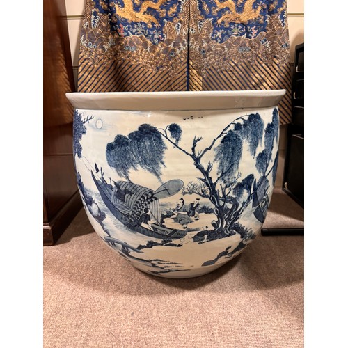 46 - A large Chinese blue and white porcelain fish bowl, decorated with boats among the reeds, diameter 5... 