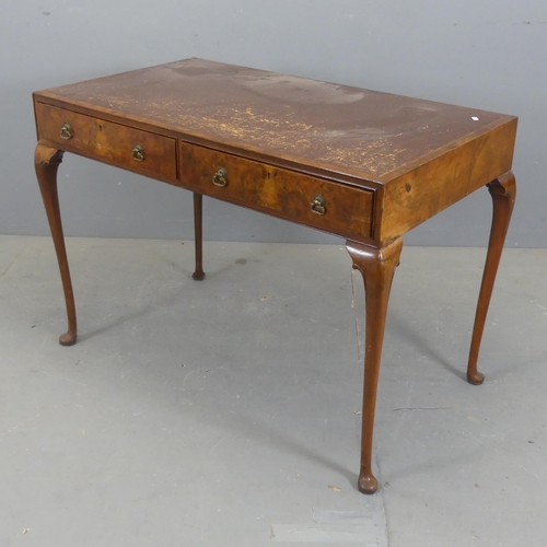 2302 - A Victorian walnut writing table, with two drawers and cabriole legs. Width 110cm, height 76cm, dept... 