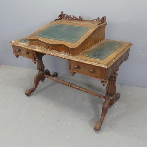 2339 - A Victorian oak writing table, with centre slope and two drawers. Width 108cm, height 94cm, depth 61... 