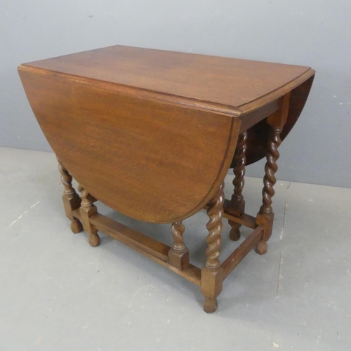 2346 - An oak oval barley-twist gate-leg drop-leaf table. Width 92cm, height 76cm, depth 50cm.