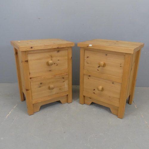 2347 - A pair of modern pine bedside chests of two drawers. Width 50cm, height 63cm, depth 37cm.