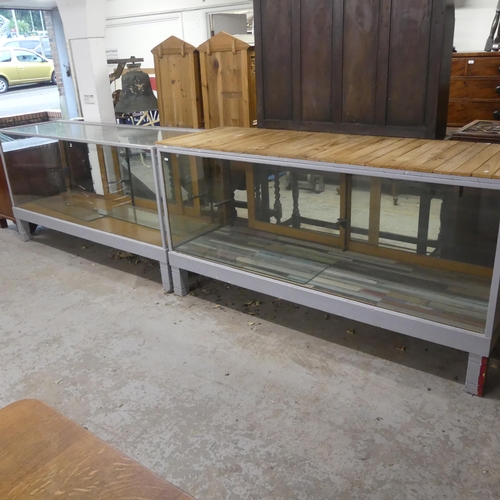 2349 - Two similar shop display cabinets, the largest - width 183cm, height 95cm, depth 60cm.