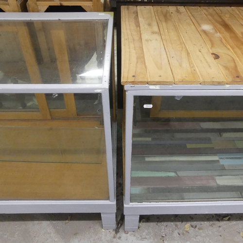 2349 - Two similar shop display cabinets, the largest - width 183cm, height 95cm, depth 60cm.