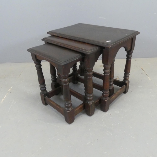 2362 - A reproduction oak nest of three rectangular occasional tables. Largest width 54cm, height 48cm, dep... 