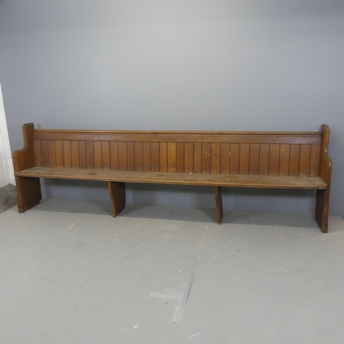 2369 - A vintage oak church pew. Length 298cm, height 90cm, depth 43cm.