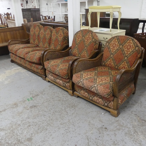 2371 - A 1930s Art Deco walnut framed three-piece Bergere lounge suite, comprising a sofa and two matching ... 