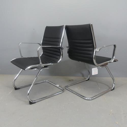 2376 - A pair of Eames style office chairs, with faux-leather upholstery on tubular metal cantilever base.... 