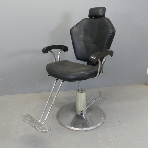 2380 - A contemporary faux-leather upholstered swivel barber's chair, mounted on chrome base with rise and ... 