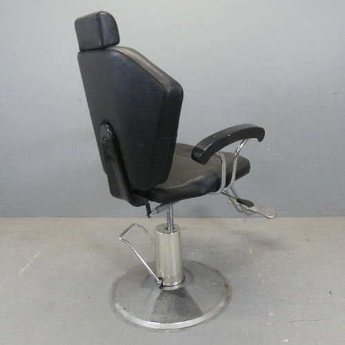 2380 - A contemporary faux-leather upholstered swivel barber's chair, mounted on chrome base with rise and ... 