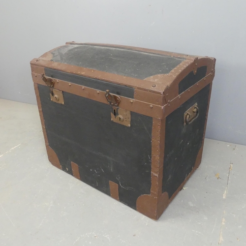 2444 - A vintage dome top trunk, with paper for Minshull Bengough. Width 69cm, height 62cm, depth 48cm.... 