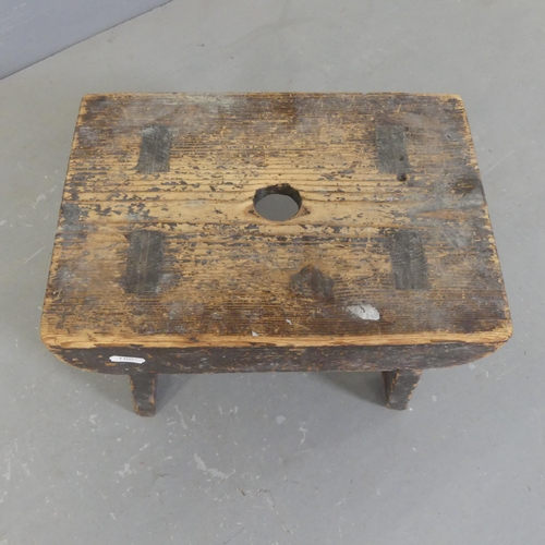 2455 - An antique stained pine footstool. Width 33cm, height 27cm, depth 23cm.