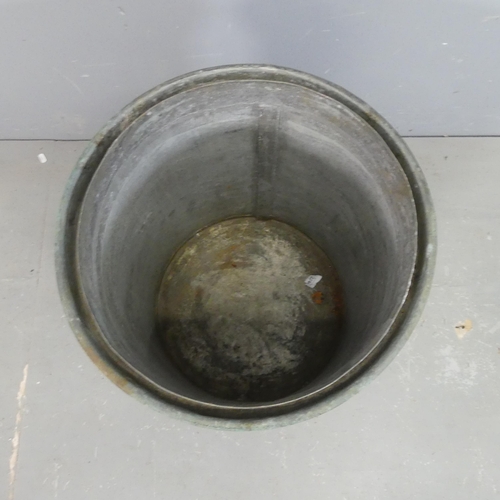 2464 - A cylindrical zinc lined copper two-handled planter. Diameter 
49cm, height 54cm.