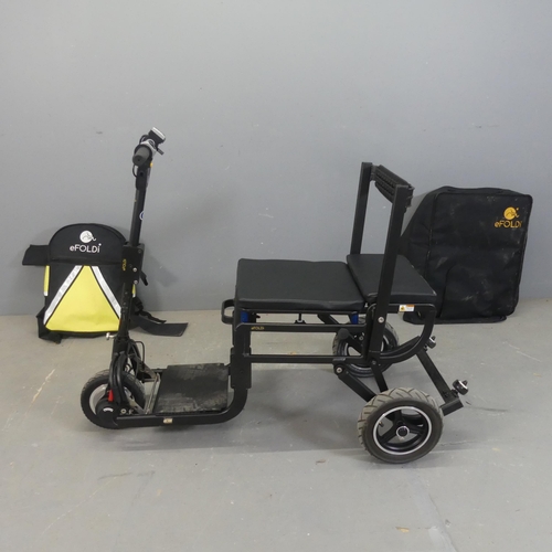 2469 - An eFoldi Lite powered folding scooter, with storage bag and backpack.