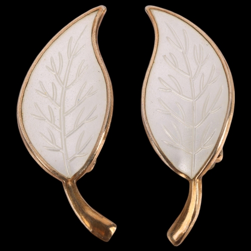 628 - MEKA - a pair of Danish modernist sterling silver-gilt white enamel leaf clip-on earrings, 32mm, 5.3... 