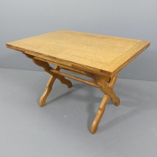 2478 - WARING & GILLOWS - an Arts and Crafts draw leaf oak dining table with chamfered X frame base, with m... 