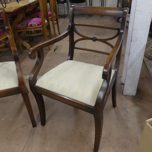 2477 - A pair of Regency style mahogany and upholstered open arm chairs.