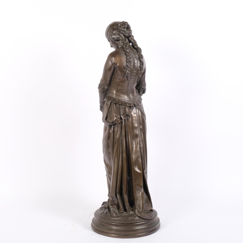 10 - After Emile-Andre Boisseau, a resin bronzed figure of a young woman holding a posy of flowers, H57cm