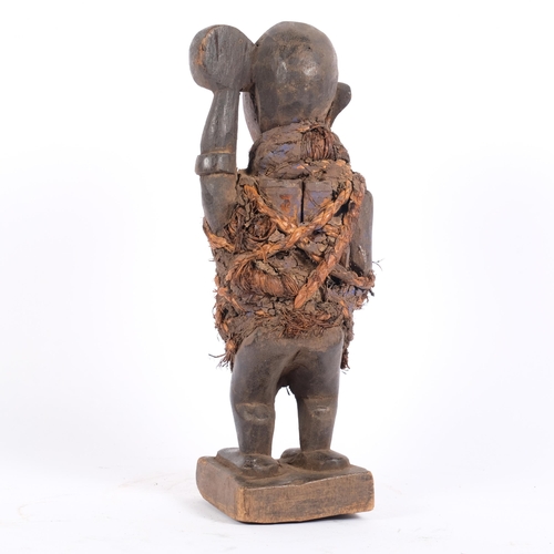 15 - A Bakongo Nkondi fetish figure, with trace of original paint, H30cm