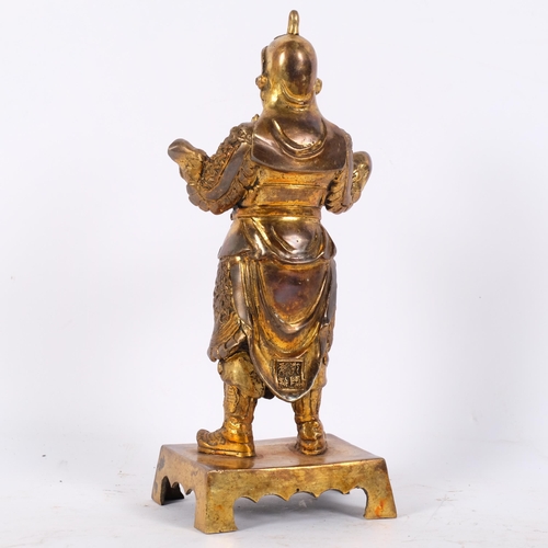 152 - A cast gilt-metal figure of Weituo Pusa, H32.5cm