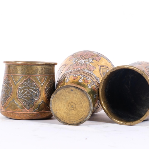 16 - A group of First World War Period Cairoware, to include a pair of small pots, stylised copper and br... 