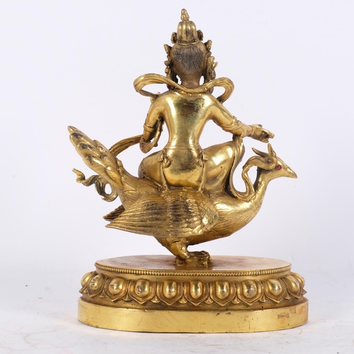 162 - A Tibetan bronze study of Mahamayuri, H23.5cm