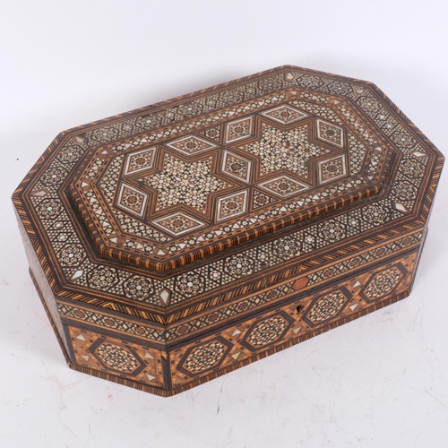 169 - An ornate Kashmiri octagonal jewel box, with symmetrical bone, mother-of-pearl and banded inlaid dec... 