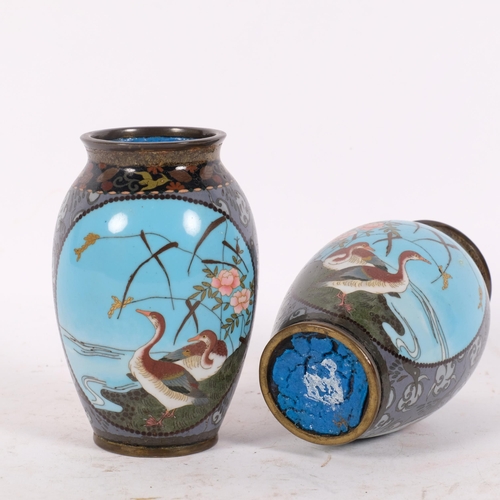 176 - A  pair of Japanese cloisonne vases, blue ground decorated with flowers and panels of birds, H12cm