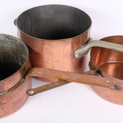 180 - 3 large Victorian copper saucepans, 1 with iron handle