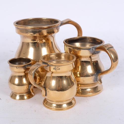 184 - A graduated set of 4 Victorian brass pub measures, tallest 10cm