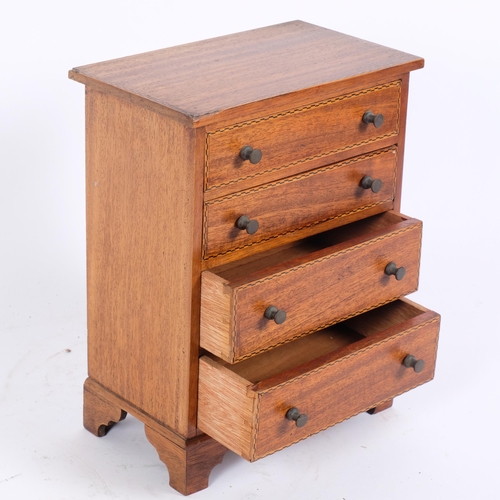 19 - An apprentice piece table-top chest of 4 drawers, with boxwood and ebony banding on bracket feet, 19... 