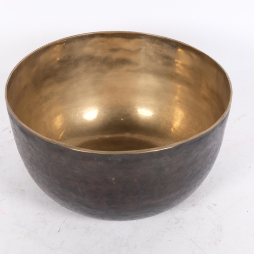 196 - A large Tibetan hammered bronze singing bowl, diameter 25cm, height 12.5cm