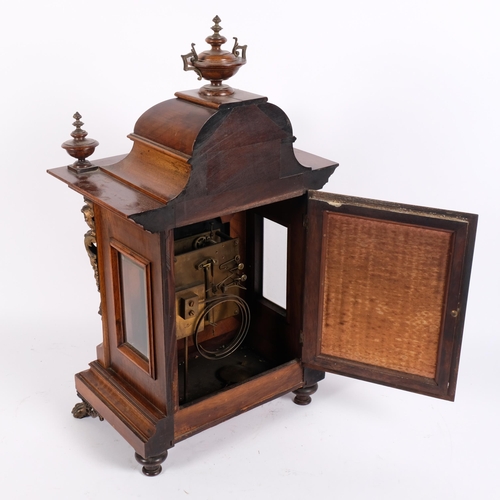 20 - An ornate 19th century walnut-cased mantel clock, with 8-day movement striking on a gong, with silve... 