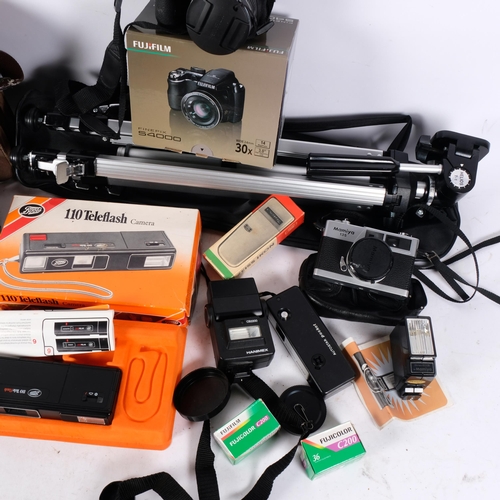 260 - A box of various cameras and accessories, including a Fujifilm Finepix S4000, a Konica FP-1 with a 5... 