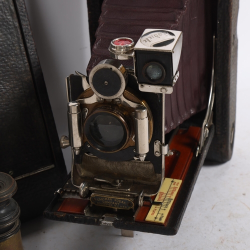 261 - 3 Vintage Kodak folding cameras, and a pair of opera glasses