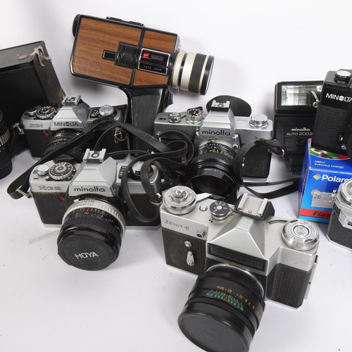 269 - A collection of various cameras and lenses, including a Minolta XG-1 with a Super Paragon 28mm lens,... 