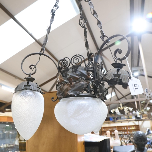 273 - An Arts and Crafts wrought-iron chandelier, with foliate decoration and frosted glass shades, 1 shad... 