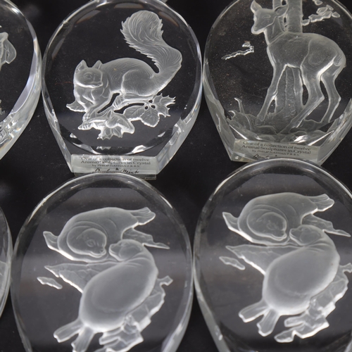 277 - A set of 12 Danbury Mint crystal glass animal sculptures, by Philip Nathan F.R.B.S, and 2 duplicates... 