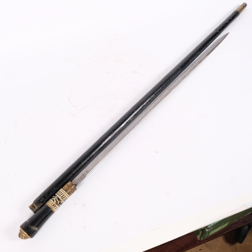 29 - An Anglo-Indian ebonised swordstick, with carved bone handle and gilt-metal mounts, 90.5cm, blade le... 