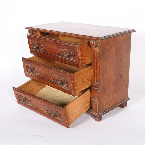 293 - A Vintage stained oak table-top chest of drawers, W37cm, H29cm, D20cm