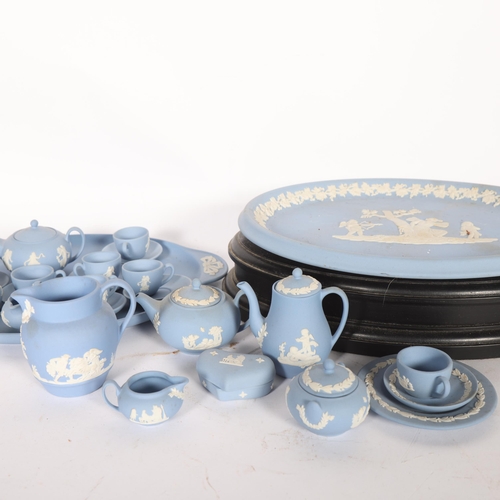 311 - A group of Wedgwood blue and white Jasperware, including miniature tea set, tray 27cm, etc