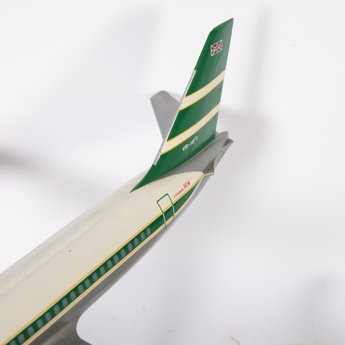 338 - 3 Cathay Pacific desk-top model aeroplanes, including a Convair A80-M on stand, a Lockeed L1011, and... 