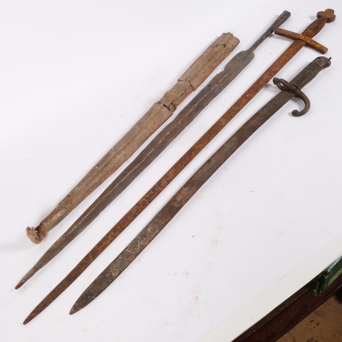 36 - A Victorian bayonet, L68cm, with steel spear tip, L83cm, with leather cover, and a sword with steel ... 