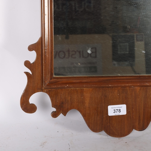 378 - A small shaped wooden wall mirror, H68cm